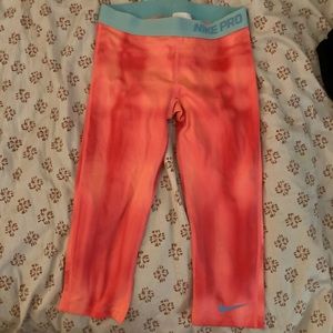 Women’s pink and blue Nike capri leggings size small